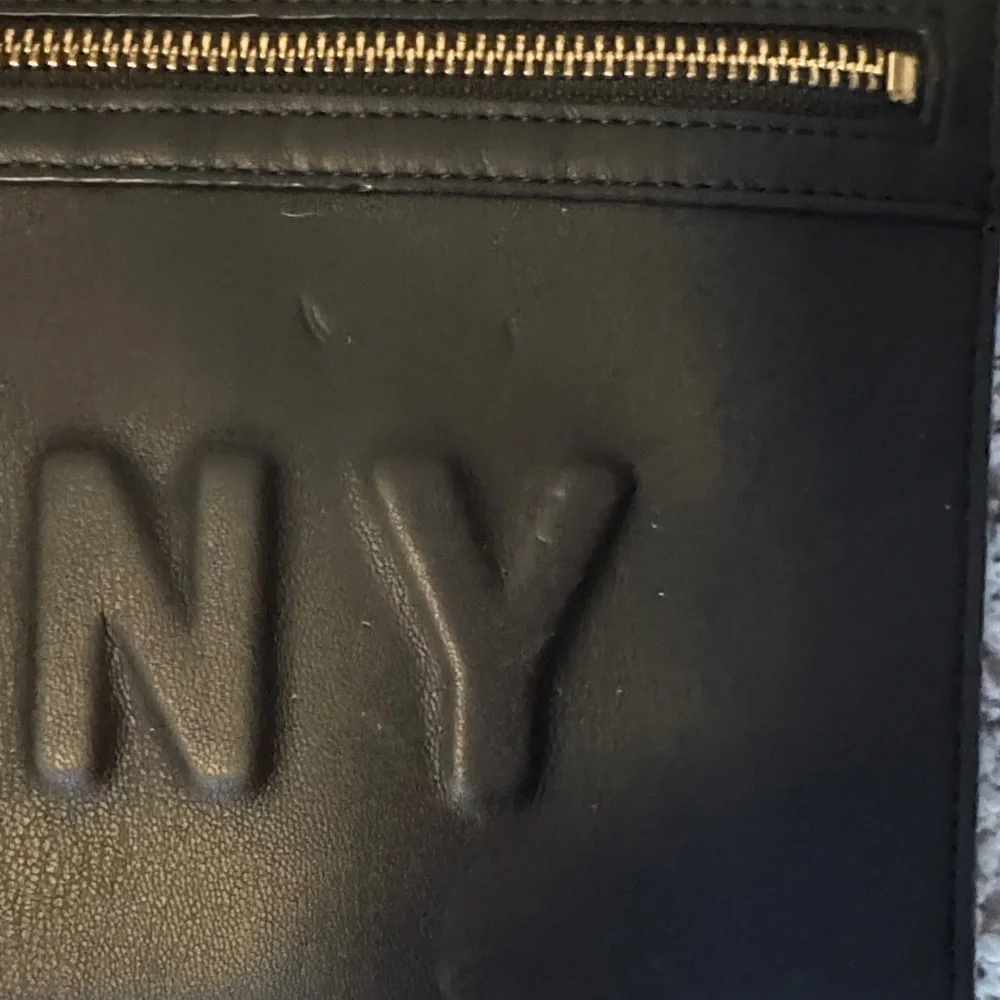 DKNY Black Clutch with Gold Accents